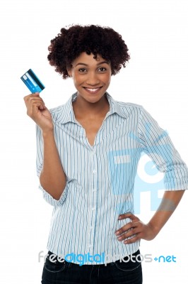 Cheerful Lady In Casuals Holding Up Cash Card Stock Photo