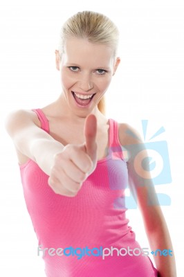 Cheerful Lady Shows Thumbsup Stock Photo