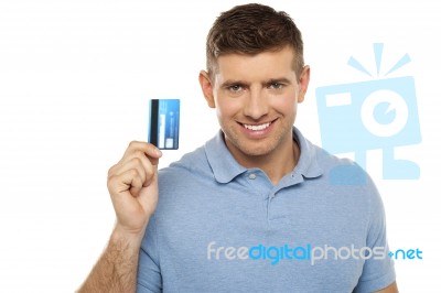 Cheerful Man Holding Credit Card Stock Photo