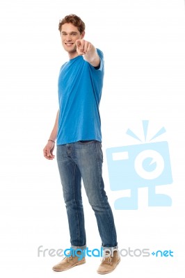 Cheerful Man Pointing Towards Camera Stock Photo