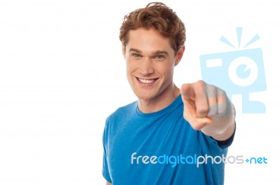 Cheerful Man Pointing Towards Camera Stock Photo