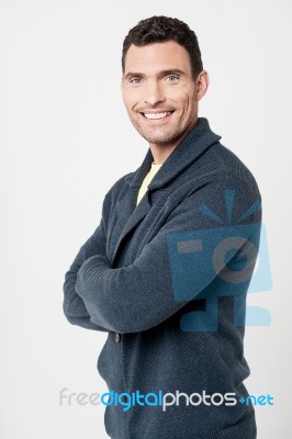 Cheerful Man With Folded Arms Stock Photo