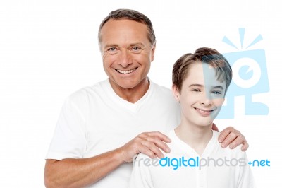 Cheerful Mature Father And Son Posing Stock Photo