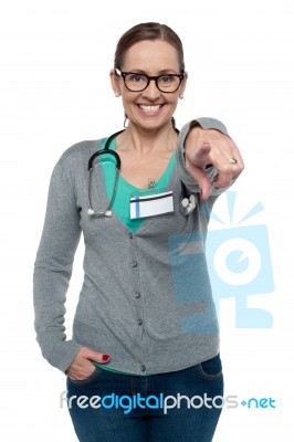 Cheerful Medical Practitioner Pointing At The Camera Stock Photo