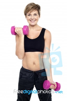 Cheerful Middle-aged Woman Woman Working Out Stock Photo