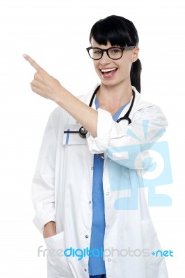 Cheerful Physician Pointing Away, Copy Space Area Stock Photo