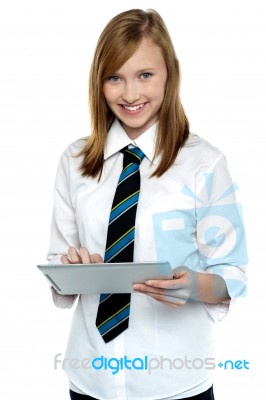 Cheerful Student In School Attire Using Tablet Pc Stock Photo