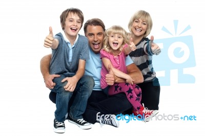 Cheerful Thumbs Up Family Stock Photo