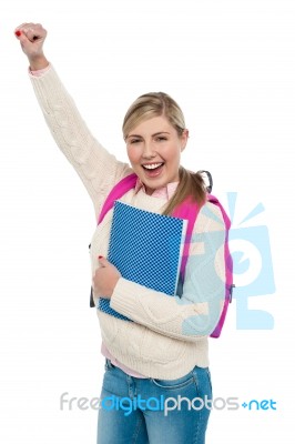 Cheerful University Student Raising Her Hand Stock Photo