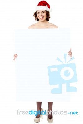 Cheerful Woman Presenting Banner Ad Board Stock Photo