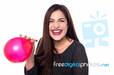 Cheerful Woman With Red Balloon Stock Photo