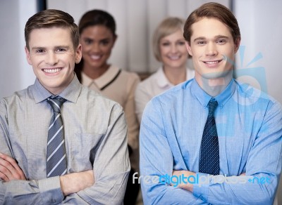 Cheerful Work Team Posing, Arms Crossed Stock Photo