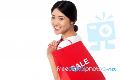 Cheerful Young Shopaholic Girl Stock Photo