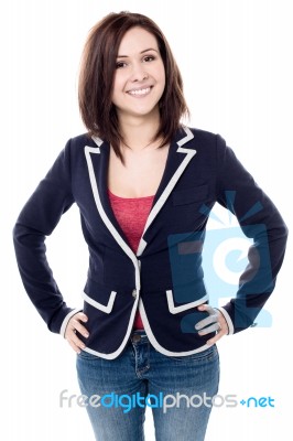 Cheerful Young Woman Posing Confidently Stock Photo