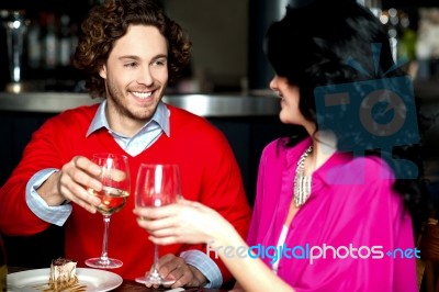 Cheers! Couple Celebrating Their Love Together Stock Photo