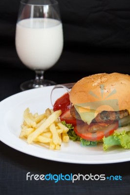 Cheeseburger With Milk Stock Photo