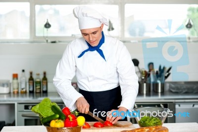 Chef Carefully Chopping Vegetables Stock Photo