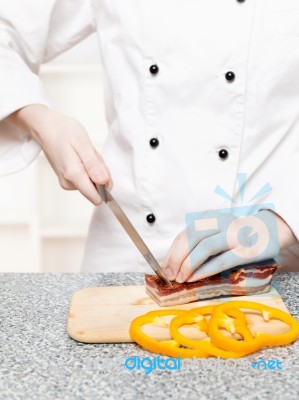 Chef Cutting Bacon Stock Photo