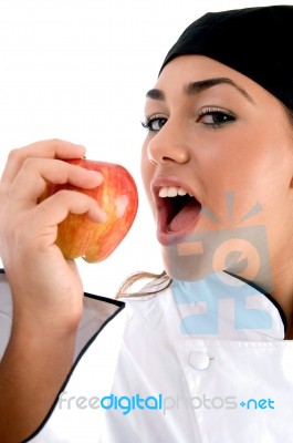 Chef Going To Eat An Apple Stock Photo