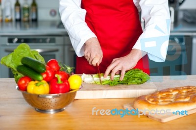 Chef Hand Chopping Vegetables Stock Photo