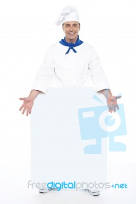 Chef Holding Blank Billboard Stock Photo