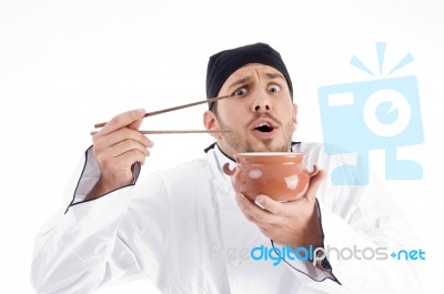 Chef Holding Bowl And Chopstick Stock Photo