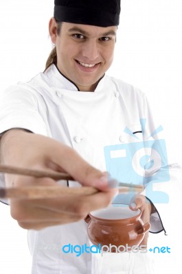 Chef  holding bowl and chopstick Stock Photo