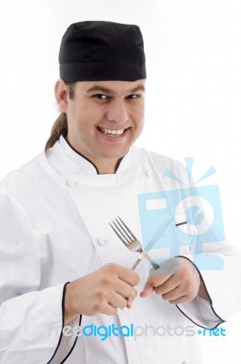 Chef Holding Fork And Knife Stock Photo