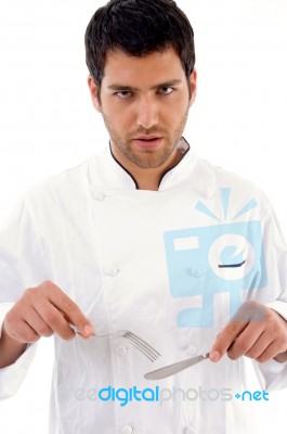 Chef Holding Knife And Fork Stock Photo