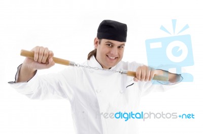 Chef Holding Nunchaku Stock Photo