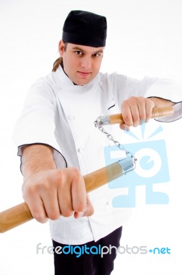 Chef Holding Nunchaku Stock Photo