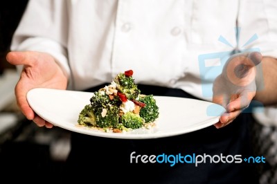 Chef Presenting Healthy Broccoli Salad Stock Photo