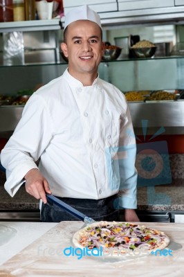 Chef With Prepared Pizza Dough Stock Photo