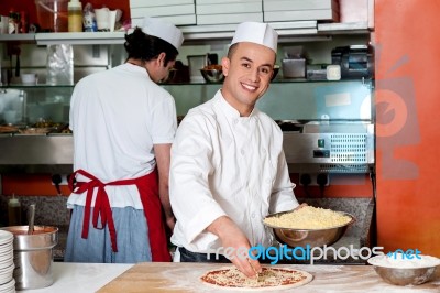 Chefs At Work Inside Restaurant Kitchen Stock Photo