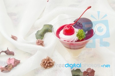 Cherry Cheesecake With Macaron Stock Photo