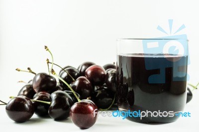 Cherry Juice And Cherries Stock Photo