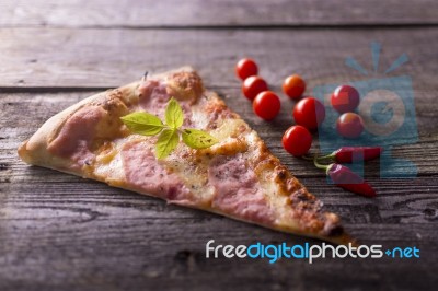 Cherry Tomato And Hot Peppers - Pizza On Table Stock Photo