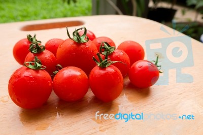 Cherry Tomato Fresh Group On Wooden Chopping Board Stock Photo