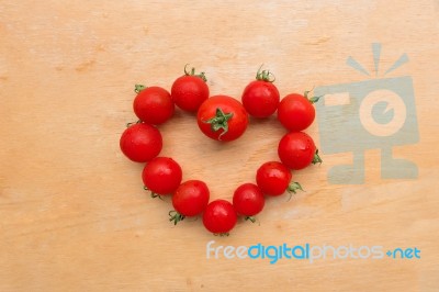 Cherry Tomato Fresh In Heart Shape On Wooden Chopping Board, Flat Lay Stock Photo