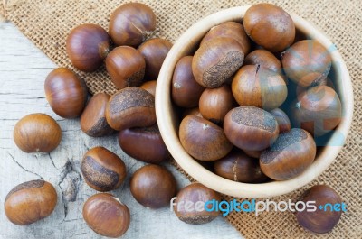 Chestnuts On Wooden Floor Stock Photo