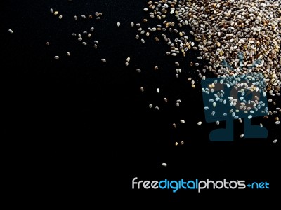 Chia Seed On Black Backgroung Stock Photo