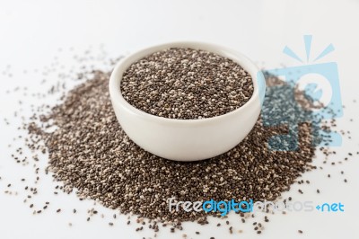 Chia Seeds In White Bowl On White Stock Photo