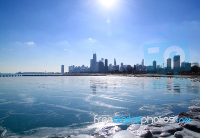 Chicago Skyline In Winter, Frozen Lake Michigan Stock Photo