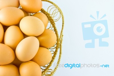 Chicken Eggs In Basket Stock Photo