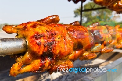 Chicken Roasted On The Spit Stock Photo