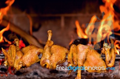 Chicken Roasting On Skewer Stock Photo