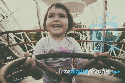 Child In Ferris Wheel Stock Photo