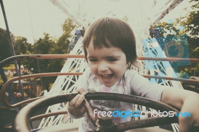 Child In Ferris Wheel Stock Photo