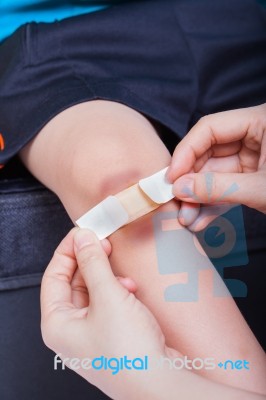 Child Knee With A Plaster (for Wounds) And Bruise Stock Photo