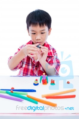 Child Moulding Whale Modeling Clay, On White Background. Strengt… Stock Photo